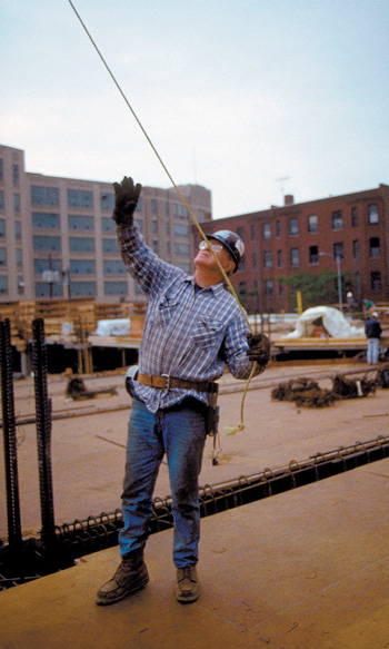 Worker guiding load